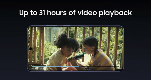 A Samsung Galaxy S26 Ultra displayed horizontally against a dark background, showing a video of two children playing. Above the device, white text reads, Up to 31 hours of video playback.