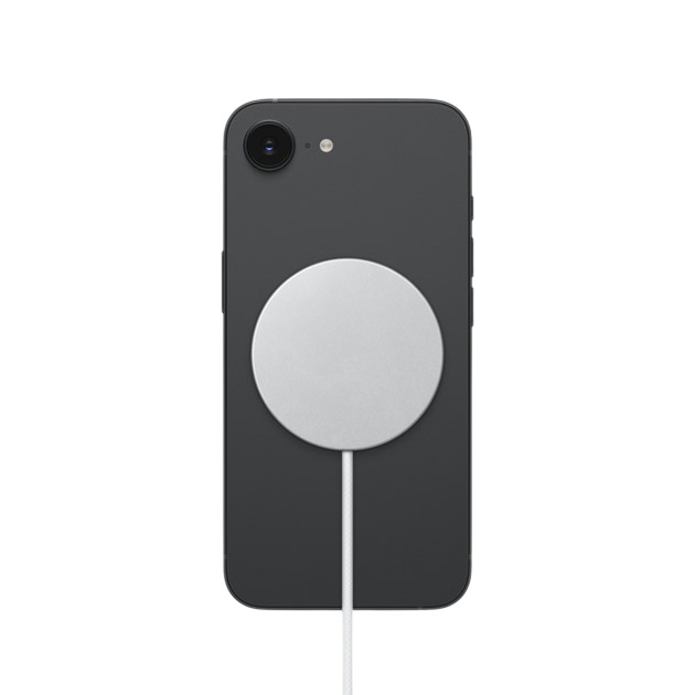Rear view of the black iPhone 17e with a white MagSafe charger magnetically attached to the center of the back panel Rear view of the black iPhone 17e with a white MagSafe charger magnetically attached to the center of the back panel.