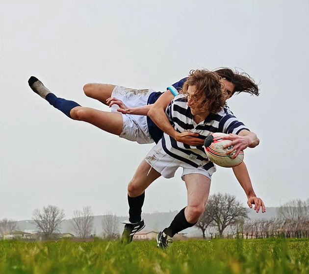 A high action sports photograph captured on the Xiaomi 15 Ultra showing a mid air rugby tackle A high-action sports photograph captured on the Xiaomi 15 Ultra showing a mid-air rugby tackle.