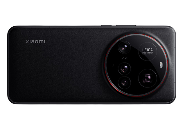 A landscape view of the back of the black Xiaomi 15 Ultra showcasing the large circular camera island with four lenses Leica branding and a subtle red accent ring around the module A landscape view of the back of the black Xiaomi 15 Ultra, showcasing the large circular camera island with four lenses, Leica branding, and a subtle red accent ring around the module.