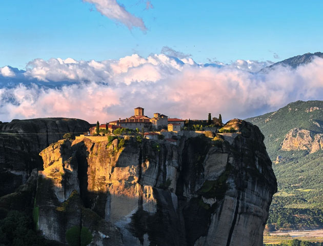 A wide angle landscape shot taken with the Huawei Pura 80 Ultra featuring a stone monastery complex perched on a massive rock formation A wide-angle landscape shot taken with the Huawei Pura 80 Ultra, featuring a stone monastery complex perched on a massive rock formation.