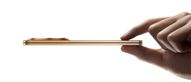 OPPO Find N6 Blossom Orange in Hand, Showing Its Thickness