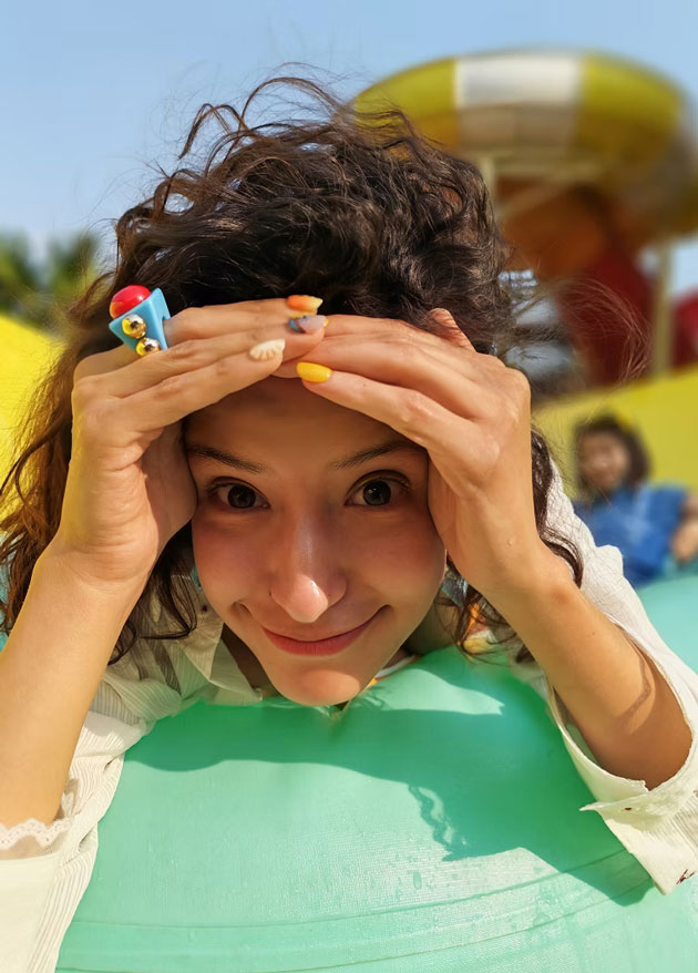 Portrait shot on the Honor 400 Pro showing a woman with playful accessories and intricate nail art Portrait shot on the Honor 400 Pro, showing a woman with playful accessories and intricate nail art.