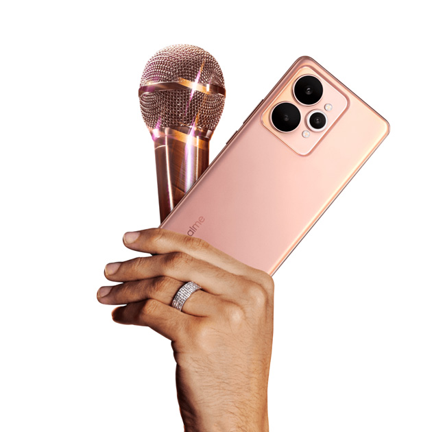 Realme 15 Silk Pink in hand and a view of the back design Realme 15 Silk Pink in hand and a view of the back design.