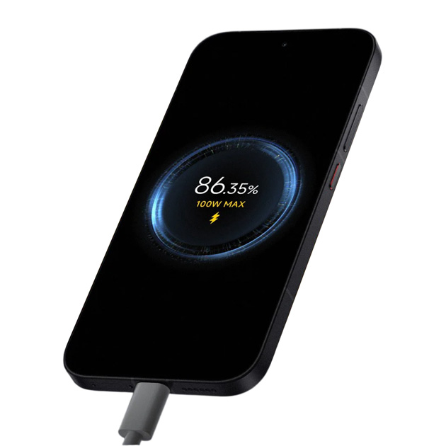 A black Poco X8 Pro is charging, and its display shows dynamic charging animation with the text ‘86.35%’ and ‘100W MAX’.