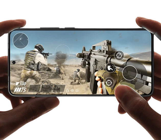 A persons hands holding a Poco F7 Pro horizontally and playing PUBG Mobile A person's hands holding a Poco F7 Pro horizontally and playing PUBG Mobile.