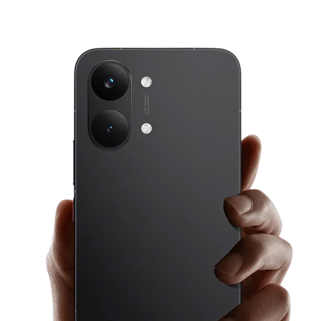 Black Poco X8 Pro MAX held vertically in a hand displaying the rear camera module and matte finish Black Poco X8 Pro MAX held vertically in a hand, displaying the rear camera module and matte finish.