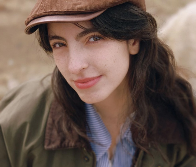 Close-up portrait in soft light with a hat and striped clothing; photo taken with OPPO Find X9 Ultra camera