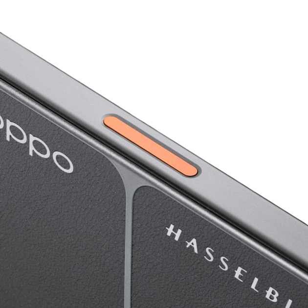 Close-up side view of the OPPO Find X9 Ultra phone with orange button and Hasselblad logo