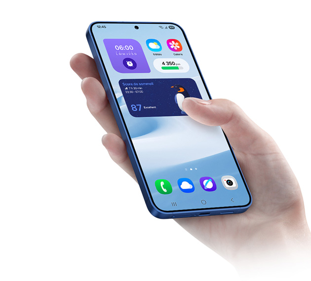 Hand holding a Samsung Galaxy S25 showing the home screen and app interface Hand holding a Samsung Galaxy S25, showing the home screen and app interface.