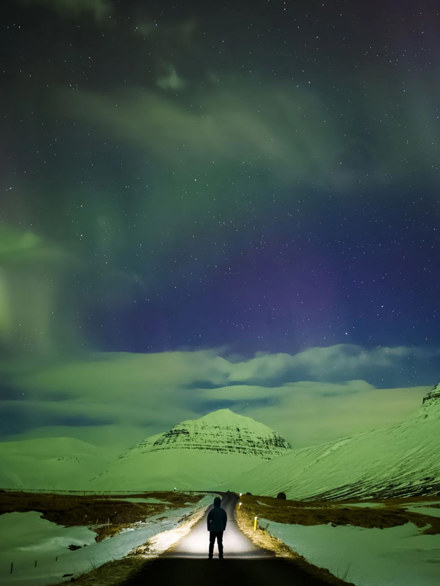 Polar aurora above a mountain road; photo taken with OPPO Find X9 Ultra camera