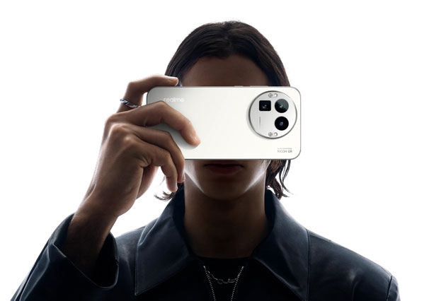 Realme GT 8 Pro held in hand with a close up of the Diary White back panel and the large circular camera module with the Ricoh GR branding.