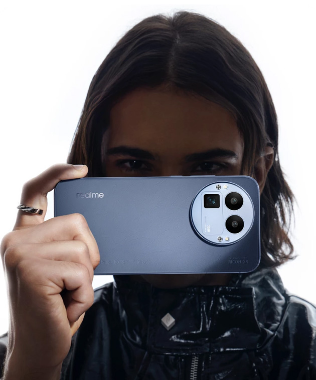 Realme GT 8 Pro held in hand with a close up of the Urban Blue back panel and the large circular camera module with the Ricoh GR branding.