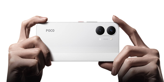 Two hands holding the white Poco X8 Pro Max horizontally as if taking a photo showing the clean rear design with horizontal stripes at the bottom Two hands holding the white Poco X8 Pro Max horizontally as if taking a photo, showing the clean rear design with horizontal stripes at the bottom.