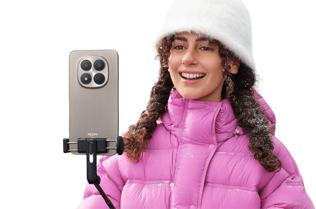A woman in a pink jacket using the camera of the Redmi Note 15 Pro 5G A woman in a pink jacket using the camera of the Redmi Note 15 Pro 5G.