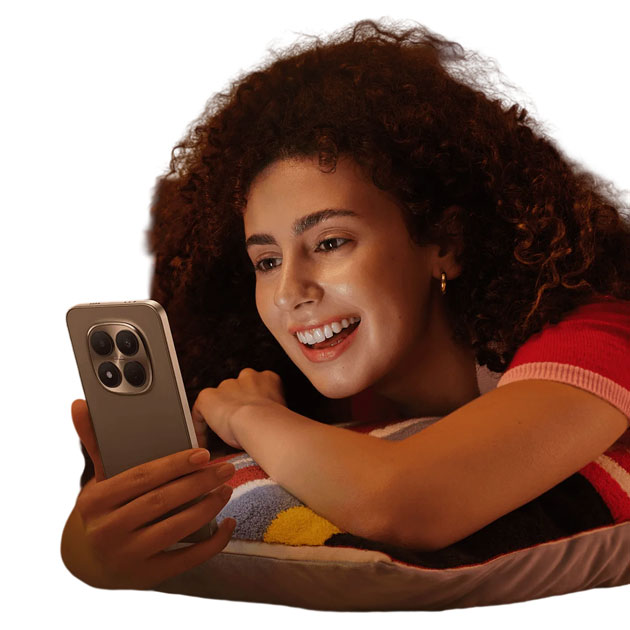 A woman using the Xiaomi Redmi Note 15 Pro 5G to watch content A woman using the Xiaomi Redmi Note 15 Pro 5G to watch content.
