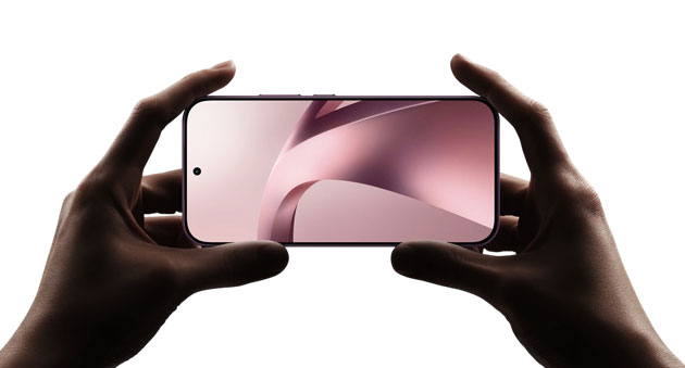 Holding a Xiaomi 17T horizontally with both hands, showcasing its full-screen display and the symmetrical bezels of the front panel.