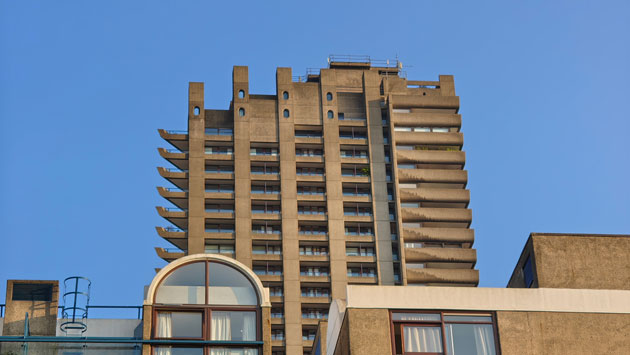 Photo taken with the Nothing Phone 3 main camera showing a full symmetrical view of the concrete Barbican tower with Brutalist architecture against a clear sky Photo taken with the Nothing Phone (3) main camera showing a full, symmetrical view of the concrete Barbican tower with Brutalist architecture against a clear sky.