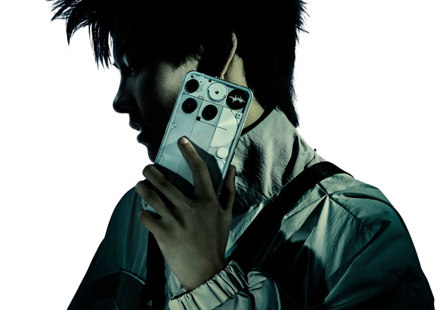 Profile view of a model with messy hair holding the Nothing Phone 3 White up to their ear Profile view of a model with messy hair holding the Nothing Phone (3) White up to their ear.