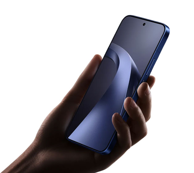 The Xiaomi 17T Pro Deep Blue in hand, showing its flat frame, side buttons, and narrow-bezel display
